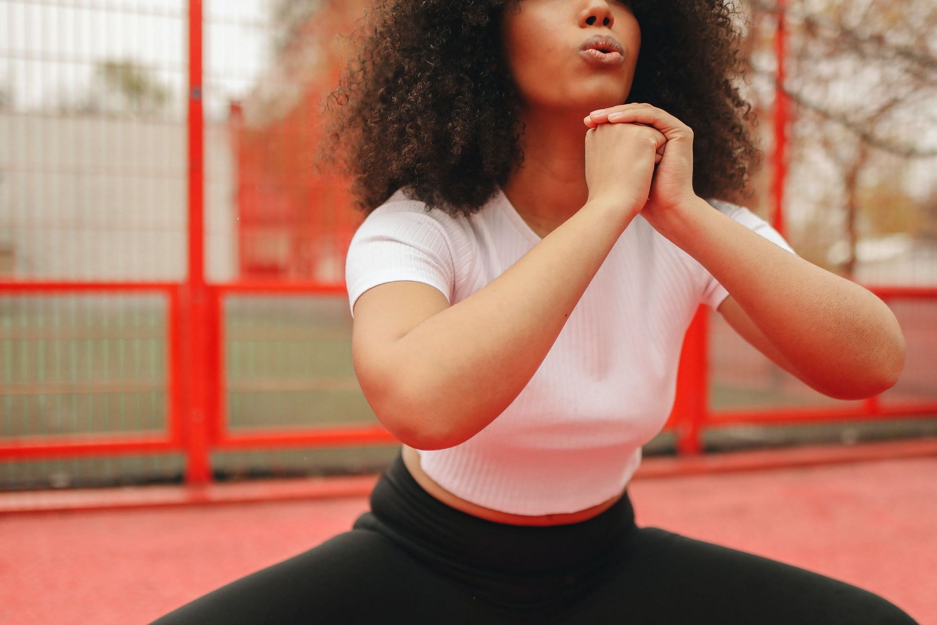 Cossack squat also targets the abdominal muscles. (Image via Pexels/Polina Tankilevitch)